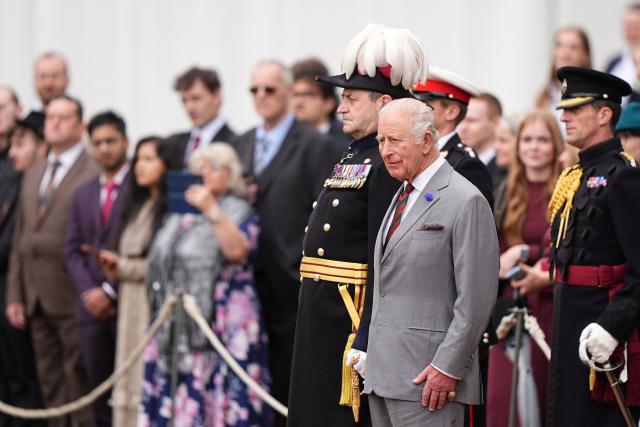 Britain's King Charles III (R) attends the traditional "Ceremony of the Keys" in the Gardens of the Palace of Holyroodhouse in Edinburgh, Scotland on June 30, 2026, on the first day of the king and queen's visit to Scotland. (Photo by Aaron Chown / POOL / AFP)