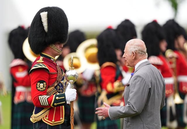 Britain's King Charles III (R) attends the traditional "Ceremony of the Keys" in the Gardens of the Palace of Holyroodhouse in Edinburgh, Scotland on June 30, 2026, on the first day of the king and queen's visit to Scotland. (Photo by Aaron Chown / POOL / AFP)