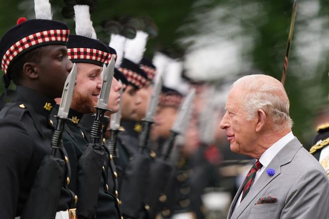 Britain's King Charles III (R) inspects the guard of honour, Balaklava Company, 5th Battalion, the Royal Regiment of Scotland during the traditional "Ceremony of the Keys" in the Gardens of the Palace of Holyroodhouse in Edinburgh, Scotland on June 30, 2026, on the first day of the king and queen's visit to Scotland. (Photo by Aaron Chown / POOL / AFP)