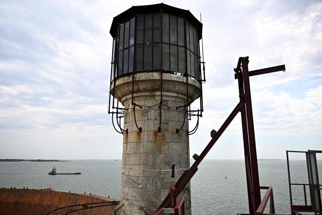 This aerial photograph shows the watchtower of the fort during levelling work conducted at the southern tip of Fort Boyard, off the Aix island in the Atlantic Ocean, southwestern France, on June 18, 2026. Levelling work started in July 2025, aiming at protecting the fort from marine erosion and creating a flat surface on the seabed to allow the construction of a promontory and a harbor by 2028 to enable tourist boats to dock for visits of the site, listed as a historical monument. (Photo by Christophe ARCHAMBAULT / AFP)