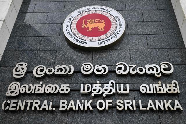 The Central Bank of Sri Lanka (CBSL) logo is seen on a building's facade in Colombo on June 30, 2026. (Photo by Ishara S. KODIKARA / AFP)