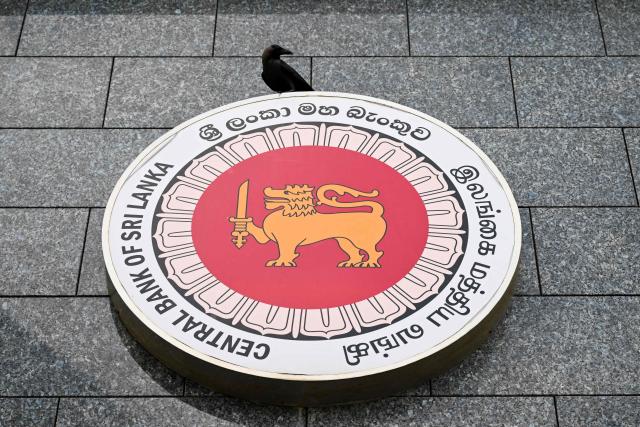 The Central Bank of Sri Lanka (CBSL) logo is seen on a building's facade in Colombo on June 30, 2026. (Photo by Ishara S. KODIKARA / AFP)
