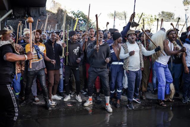 Protesters hold sticks and chant slogans as they march during a demonstration by the "March and March" and Operation Dudula movements marking an unofficial deadline set by citizen-led groups for undocumented foreign nationals to leave South Africa, in Johannesburg, on June 30, 2026. South African police deployed to head off unrest and protests on June 30, 2026, the unofficial deadline set by anti-immigrant groups for undocumented foreign nationals to leave that has already pushed thousands to flee.
Officers were out in force to prevent violence and looting by the xenophobic groups, while hundreds of foreign nationals took refuge in several cities, urgently seeking help to leave. (Photo by EMMANUEL CROSET / AFP)