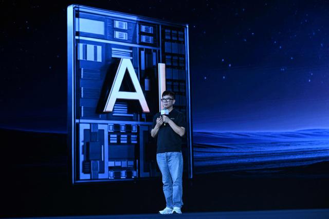 Zhou Jian, also known as James Zhou and founder of UBTECH Robotics delivers his speech during the launch of the U1 humanoid robot produced by UWORLD, a brand under UBTECH Robotics, in Shenzhen, China's Guangdong province on June 30, 2026. Silicone skin, soothing voice: Chinese company UBTech unveiled unprecedented hyper-realistic human-looking androids equipped with artificial intelligence (AI) and presented as anti-loneliness remedies. (Photo by ADEK BERRY / AFP)