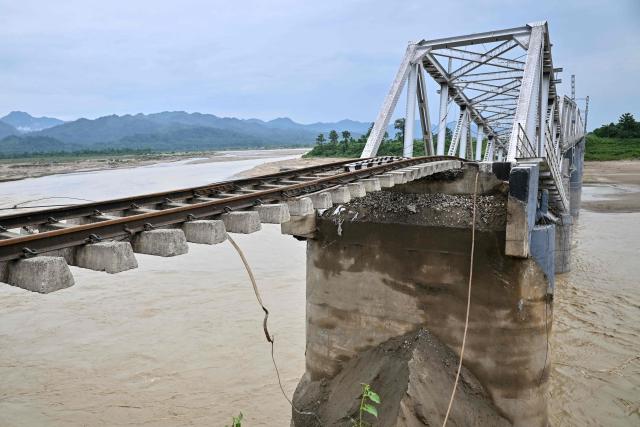 A damaged railway bridge is seen following monsoon floods in Dhemaji on June 30, 2026. (Photo by Biju BORO / AFP)
