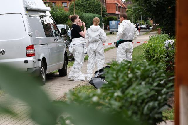 Forensic Police officers work at the scene where six people were killed in a shooting the day before in Stade, northern Germany, a city some 50 kilometres west of Hamburg, on June 30, 2026. The suspected shooter who killed six people at a German youth welfare centre on Monday was in a custody dispute over his three-month-old daughter, police said. The victims of the shooting -- four women and two men -- were youth welfare employees, a police official told a press conference. The girl and her mother were in the office at the time of the shooting but were not harmed. (Photo by Ibrahim OT / AFP)
