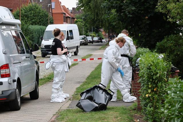 Forensic Police officers work at the scene where six people were killed in a shooting the day before in Stade, northern Germany, a city some 50 kilometres west of Hamburg, on June 30, 2026. The suspected shooter who killed six people at a German youth welfare centre on Monday was in a custody dispute over his three-month-old daughter, police said. The victims of the shooting -- four women and two men -- were youth welfare employees, a police official told a press conference. The girl and her mother were in the office at the time of the shooting but were not harmed. (Photo by Ibrahim OT / AFP)