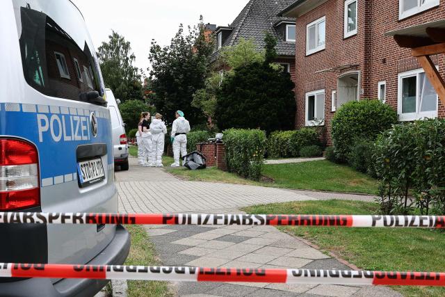Forensic Police officers work at the scene where six people were killed in a shooting the day before in Stade, northern Germany, a city some 50 kilometres west of Hamburg, on June 30, 2026. The suspected shooter who killed six people at a German youth welfare centre on Monday was in a custody dispute over his three-month-old daughter, police said. The victims of the shooting -- four women and two men -- were youth welfare employees, a police official told a press conference. The girl and her mother were in the office at the time of the shooting but were not harmed. (Photo by Ibrahim OT / AFP)