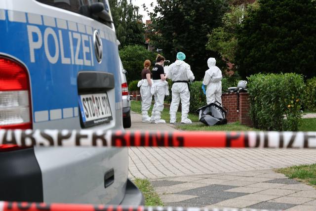 Forensic Police officers work at the scene where six people were killed in a shooting the day before in Stade, northern Germany, a city some 50 kilometres west of Hamburg, on June 30, 2026. The suspected shooter who killed six people at a German youth welfare centre on Monday was in a custody dispute over his three-month-old daughter, police said. The victims of the shooting -- four women and two men -- were youth welfare employees, a police official told a press conference. The girl and her mother were in the office at the time of the shooting but were not harmed. (Photo by Ibrahim OT / AFP)