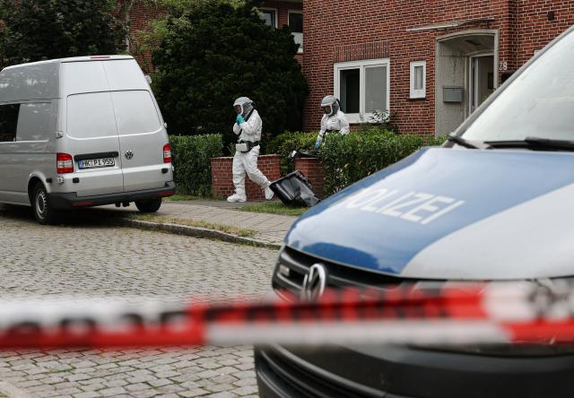 Forensic Police officers work at the scene where six people were killed in a shooting the day before in Stade, northern Germany, a city some 50 kilometres west of Hamburg, on June 30, 2026. The suspected shooter who killed six people at a German youth welfare centre on Monday was in a custody dispute over his three-month-old daughter, police said. The victims of the shooting -- four women and two men -- were youth welfare employees, a police official told a press conference. The girl and her mother were in the office at the time of the shooting but were not harmed. (Photo by Ibrahim OT / AFP)