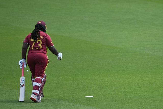 West Indies' Qiana Joseph walks back to the pavilion having lost her wicket for 16 runs during the ICC Women's T20 cricket world cup 2026 semi-final game between Australia and West Indies, at The Oval in London on June 30, 2026. (Photo by JUSTIN TALLIS / AFP)