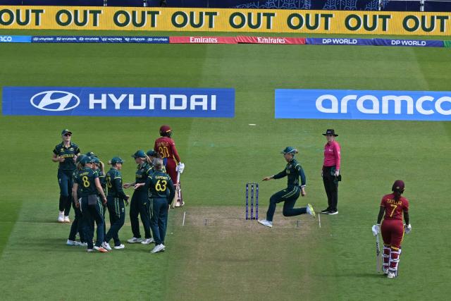 Australia's players celebrate taking the wicket of West Indies' Stafanie Taylor (R) during the ICC Women's T20 cricket world cup 2026 semi-final game between Australia and West Indies, at The Oval in London on June 30, 2026. (Photo by JUSTIN TALLIS / AFP)