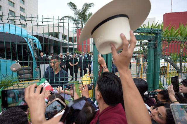 Fans and journalists' film Iran's players outside Iran's base camp ahead of the team's departure following its elimination from the 2026 World Cup football tournament in Tijuana on June 30, 2026. (Photo by Guillermo Arias / AFP)