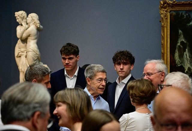 Joachim Sauer (C), husband of forger German Chancellor Angela Merkel attends the presentation of the painting “Portrait of former Federal Chancellor Angela Merkel” by French-German artist Jeremie Queyras at the Bode Museum in Berlin on June 30, 2026. (Photo by Tobias SCHWARZ / AFP)