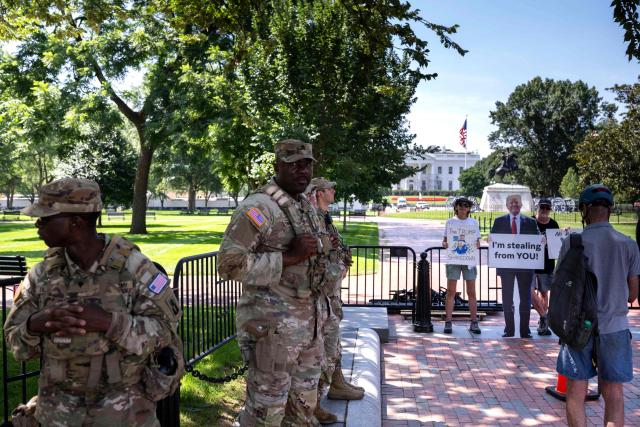 Members of the National Guard stand watch as people gather outside Lafayette Square near the White House in Washington, DC, on June 30, 2026. (Photo by Kent Nishimura / AFP)