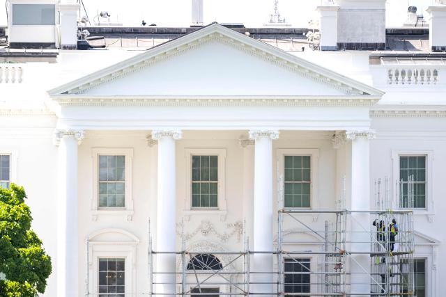 Workers build scaffolding around the columns of the North Portico of the White House in Washington, DC, on June 30, 2026. (Photo by Kent Nishimura / AFP)