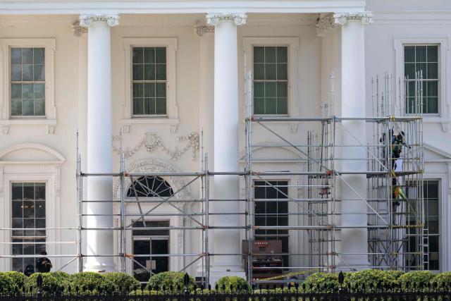 Workers build scaffolding around the columns of the North Portico of the White House in Washington, DC, on June 30, 2026. (Photo by Kent Nishimura / AFP)