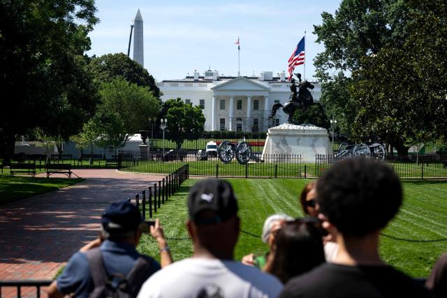 People view the White House from Lafayette Square as workers build scaffolding around the columns of the North Portico of the White House in Washington, DC, on June 30, 2026. (Photo by Kent Nishimura / AFP)