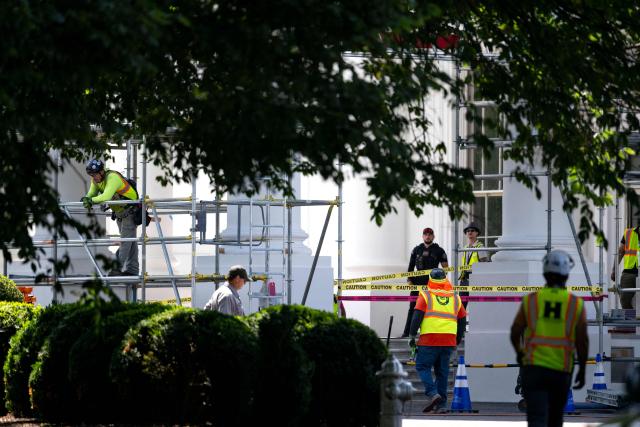 Workers build scaffolding around the columns of the North Portico of the White House in Washington, DC, on June 30, 2026. (Photo by Kent Nishimura / AFP)
