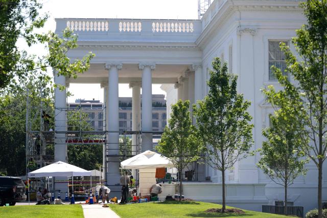 Workers build scaffolding around the columns of the North Portico of the White House in Washington, DC, on June 30, 2026. (Photo by Kent Nishimura / AFP)