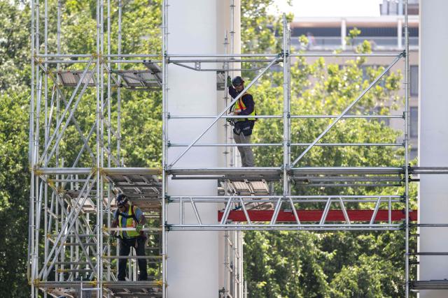 Workers build scaffolding around the columns of the North Portico of the White House in Washington, DC, on June 30, 2026. (Photo by Kent Nishimura / AFP)