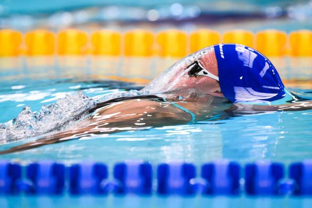 French swimmer Bertille Cosson competes in the women's 100m backstroke final during the French national swimming championships in Saint-Etienne on June 30, 2026. (Photo by OLIVIER CHASSIGNOLE / AFP)