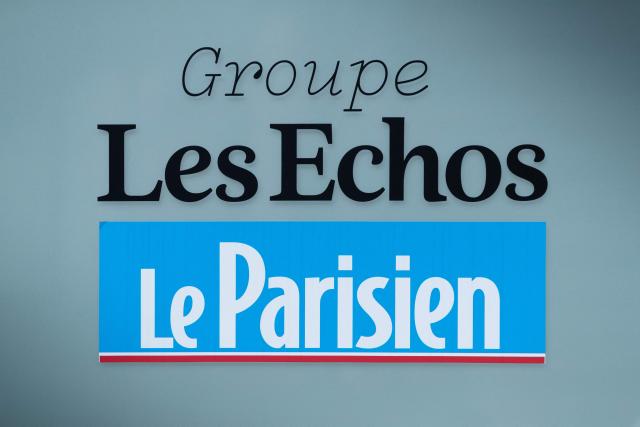 (FILES) This photograph shows the logo of Les Echos and Le Parisien at the headquarters of the company in Paris on March 2, 2022. The management of the press group Les Echos-Le Parisien, owned by luxury giant LVMH, announced on June 30, 2026, a reorganisation that will cut around sixty positions outside newsrooms, as part of cost-cutting efforts amid a crisis in the press industry. (Photo by JOEL SAGET / AFP)