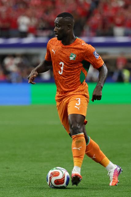 Ivory Coast's defender #03 Ghislain Konan runs with the ball during the 2026 World Cup round of 32 football match between Ivory Coast and Norway at the Dallas Stadium in Arlington on June 30, 2026.  (Photo by Aric Becker / AFP)