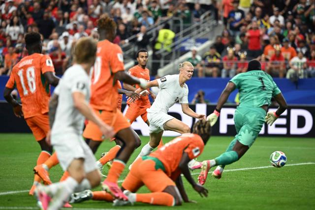 Norway's forward #09 Erling Braut Haaland (C) shoots and scores his team's second goal during the 2026 World Cup round of 32 football match between Ivory Coast and Norway at the Dallas Stadium in Arlington on June 30, 2026.  (Photo by Paul ELLIS / AFP)