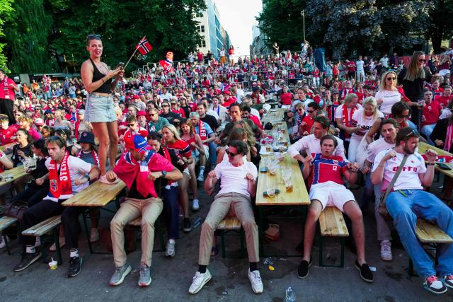 Norway fans do the "Viking Row" after the victory in 2026 World Cup round of 32 football match between Ivory Coast and Norway after watching the match at Kongens gate in Oslo on June 30, 2026. (Photo by Terje Bendiksby / NTB / AFP) / Norway OUT