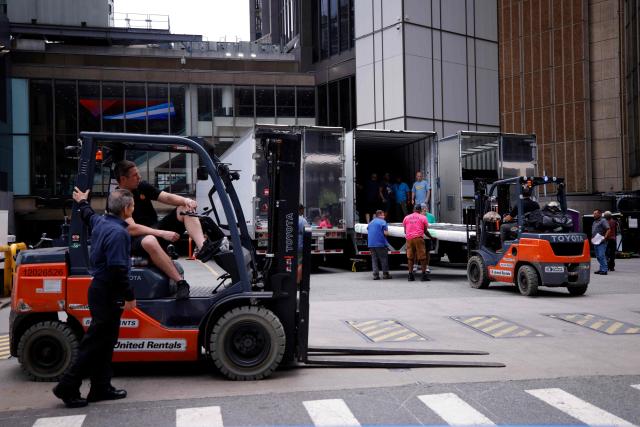 Forklifts and trucks are seen outside Madison Square Garden in New York on June 30, 2026. Increasing signs point to a mega-bash for the A-list celebrity couple Taylor Swift and Travis Kelce at Madison Square Garden this week. Rumors have run rampant for weeks that the 36-year-old pop superstar and the three-time NFL Super Bowl winner, both 36, could wed at the storied sports arena, home to the New York Knicks, the newly crowned NBA champions. (Photo by Leonardo MUNOZ / AFP)
