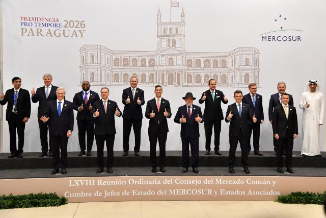 (L-R, front row) The presidents of Chile, Jose Antonio Kast; Uruguay, Yamandu Orsi; Paraguay, Santiago Pena; Brazil, Luiz Inacio Lula da Silva; Bolivia, Rodrigo Paz; and Ecuador, Daniel Noboa, give the thumbs up during the 68th Mercosur Heads of State summit at the Conmebol headquarters, in Luque, Paraguay on June 30, 2026. (Photo by DANIEL DUARTE / AFP)
