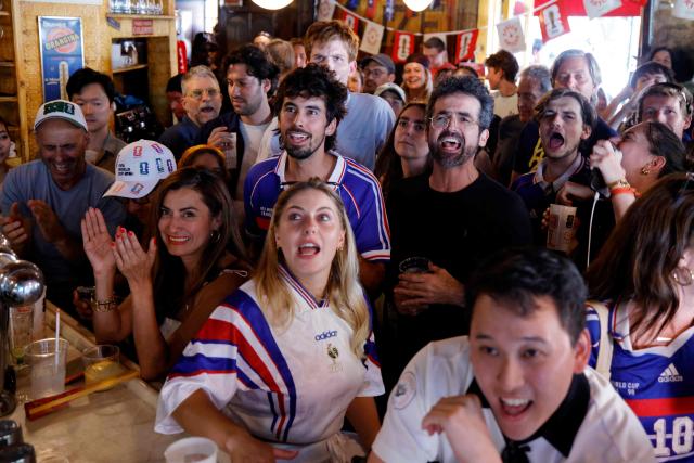 France fans react as they watch the 2026 World Cup match between France and Sweden in the Brooklyn borough of New York City on June 30, 2026. (Photo by Leonardo MUNOZ / AFP)