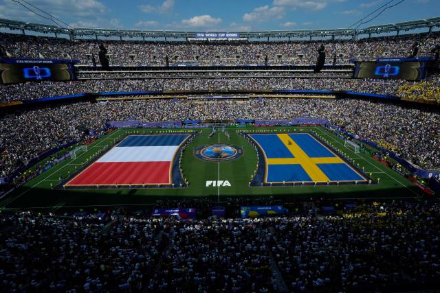 France and Sweden flags are displayed on the pitch ahead of the 2026 World Cup round of 32 football match between France and Sweden at the New York/New Jersey Stadium in East Rutherford on June 30, 2026.  (Photo by TIMOTHY A. CLARY / AFP)