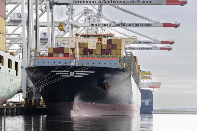 This photograph shows a container ship being unloaded as it is moored in Le Havre harbour on June 30, 2026. (Photo by Alain JOCARD / AFP)
