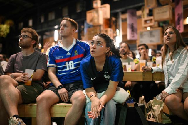 France supporters watch the 2026 World Cup round of 32 football match between France and Sweden on a giant screen at 'La Communale de Saint-Ouen', in Saint-Ouen, north of Paris, on June 30, 2026. (Photo by Julie SEBADELHA / AFP)