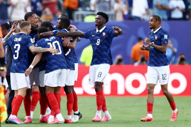 France's forward #10 Kylian Mbappe celebrates scoring his team's first goal with teammates during the 2026 World Cup round of 32 football match between France and Sweden at the New York/New Jersey Stadium in East Rutherford on June 30, 2026.  (Photo by CHARLY TRIBALLEAU / AFP)