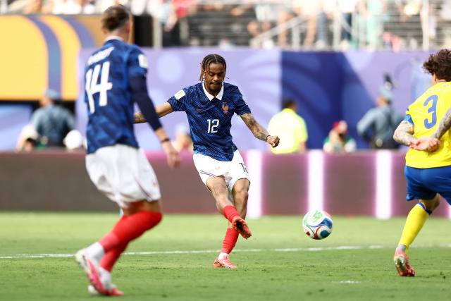 France's forward #12 Bradley Barcola scores his team's second goal during the 2026 World Cup round of 32 football match between France and Sweden at the New York/New Jersey Stadium in East Rutherford on June 30, 2026.  (Photo by CHARLY TRIBALLEAU / AFP)