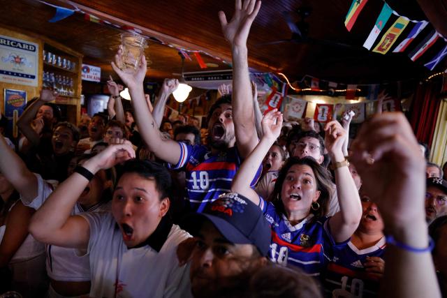 France fans react as they watch the 2026 World Cup match between France and Sweden in the Brooklyn borough of New York City on June 30, 2026. (Photo by Leonardo MUNOZ / AFP)