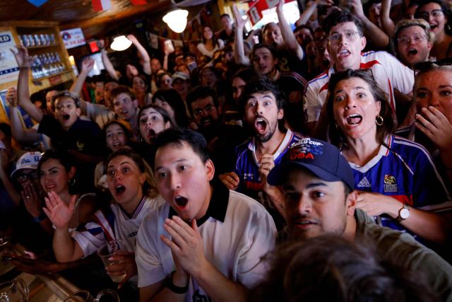 France fans react as they watch the 2026 World Cup match between France and Sweden in the Brooklyn borough of New York City on June 30, 2026. (Photo by Leonardo MUNOZ / AFP)