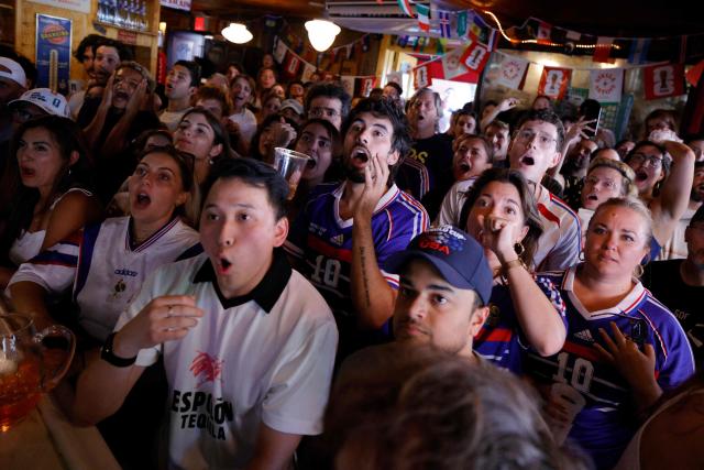 France fans react as they watch the 2026 World Cup match between France and Sweden in the Brooklyn borough of New York City on June 30, 2026. (Photo by Leonardo MUNOZ / AFP)