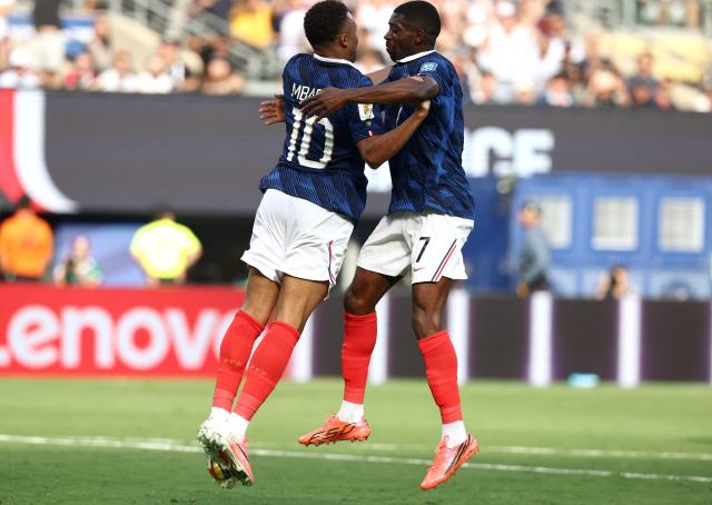 France's forward #10 Kylian Mbappe celebrates scoring his team's first goal with forward #07 Ousmane Dembele during the 2026 World Cup round of 32 football match between France and Sweden at the New York/New Jersey Stadium in East Rutherford on June 30, 2026.  (Photo by Franck FIFE / AFP)