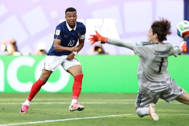 France's forward #10 Kylian Mbappe scores his team's third goal past Sweden's goalkeeper #01 Jacob Widell Zetterstrom during the 2026 World Cup round of 32 football match between France and Sweden at the New York/New Jersey Stadium in East Rutherford on June 30, 2026.  (Photo by CHARLY TRIBALLEAU / AFP)