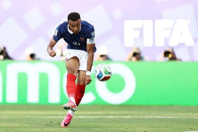 France's forward #10 Kylian Mbappe kicks the ball and scores his team's third goal during the 2026 World Cup round of 32 football match between France and Sweden at the New York/New Jersey Stadium in East Rutherford on June 30, 2026.  (Photo by CHARLY TRIBALLEAU / AFP)