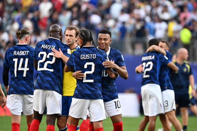 France's forward #10 Kylian Mbappe celebrates with defender #02 Malo Gusto after winning the 2026 World Cup round of 32 football match between France and Sweden at the New York/New Jersey Stadium in East Rutherford on June 30, 2026.  (Photo by Jewel SAMAD / AFP)