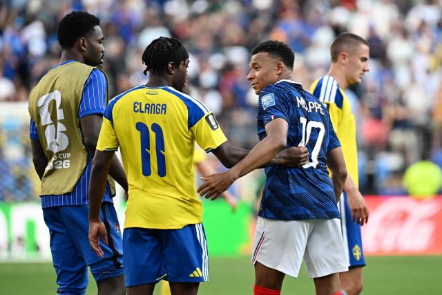 Sweden's forward #11 Anthony Elanga and France's forward #10 Kylian Mbappe talk after the 2026 World Cup round of 32 football match between France and Sweden at the New York/New Jersey Stadium in East Rutherford on June 30, 2026.  (Photo by Jewel SAMAD / AFP)