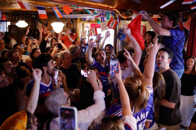 France fans celebrate after their team won the 2026 World Cup match between France and Sweden in the Brooklyn borough of New York City, on June 30, 2026. (Photo by Leonardo MUNOZ / AFP)