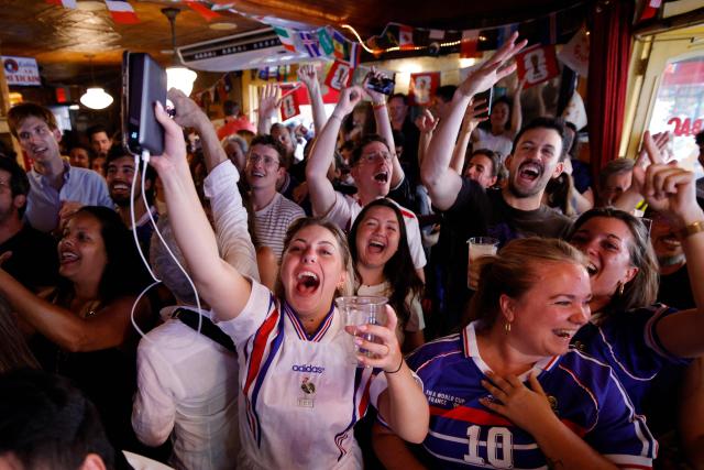 France fans celebrate after their team won the 2026 World Cup match between France and Sweden in the Brooklyn borough of New York City, on June 30, 2026. (Photo by Leonardo MUNOZ / AFP)