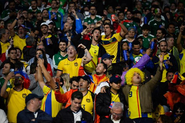 Ecuador fans cheer during the 2026 World Cup round of 32 football match between Mexico and Ecuador at the Mexico City Stadium in Mexico City on June 30, 2026.  (Photo by Alfredo ESTRELLA / AFP)