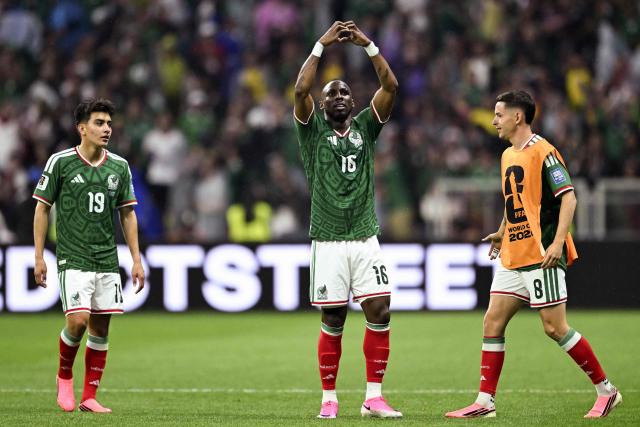 Mexico's forward #16 Julian Quinones celebrates next to teammates midfielder #19 Gilberto Mora and midfielder #08 Alvaro Fidalgo scoring his team's first goal during the 2026 World Cup round of 32 football match between Mexico and Ecuador at the Mexico City Stadium in Mexico City on June 30, 2026.  (Photo by CARL DE SOUZA / AFP)